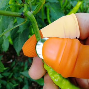 Close-up of V thumb cutter for peeling vegetables.